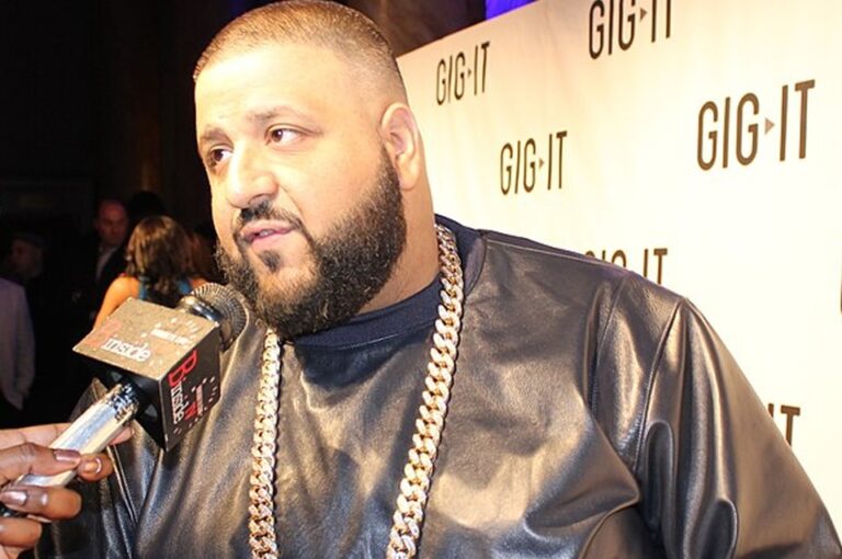 DJ Khaled net worth. Photo of him giving an interview in 2012.